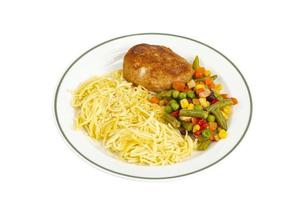 Plate with noodles, vegetables and breaded cutlet. photo