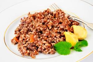 Pilaf with Meat, Carrots and Red Rice photo