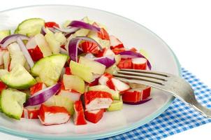 Fresh vegetable salad with crab sticks. Photo