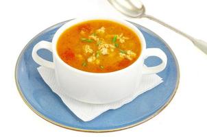 Thick homemade vegetable soup with rice, pumpkin and tomatoes photo