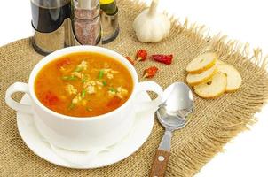 Thick homemade vegetable soup with rice, pumpkin and tomatoes photo