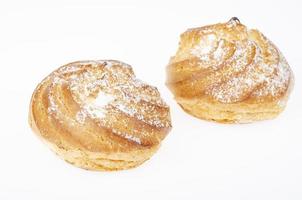 Fresh homemade cakes with cream and powdered sugar. Studio Photo