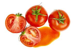 Blot of tomato juice and fresh red tomatoes isolated on white background. photo