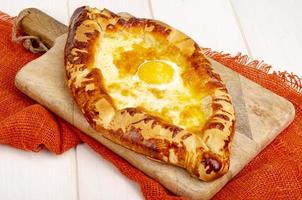 Homemade cakes, khachapuri with cheese and egg photo