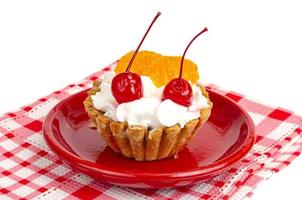 Cake with whipped cream and fruit, berries. photo