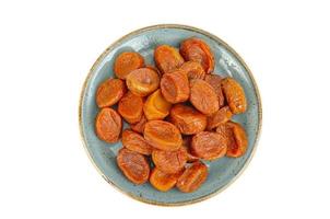 Orange fruits of dried apricot on white background. photo