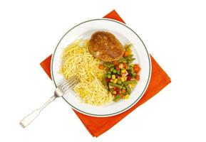 Plate with noodles, vegetables and breaded cutlet. photo