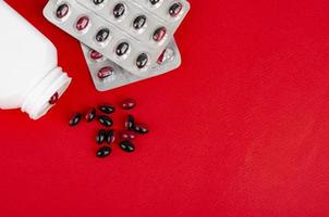 Bicolor medical pills on bright background. Photo