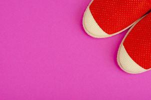 Summer composition of hats and shoes on bright background photo