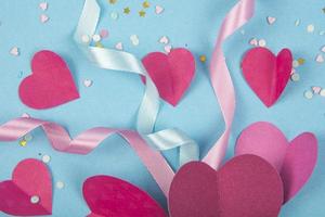 Abstract Background with Paper Hearts, ribbons for Valentine s Day. Blue Love and Feeling Background for poster, banner, post, card photo