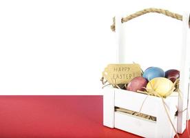 Colorful background with Easter eggs on red and white background. Happy Easter concept. Can be used as poster, background, holiday card. Flat lay, top view, copy space. Studio Photo