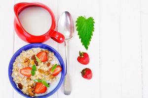 Oatmeal with Raisins, Walnuts and Strawberries photo