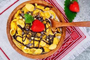 Cornflakes with Strawberry and Chocolate. Healthy Breakfast photo