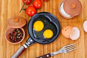 Raw Eggs on Wood Plate photo