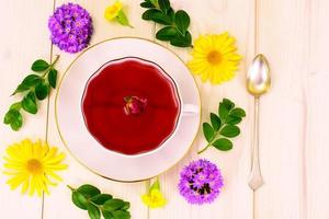 Red Rose Hibiscus Tea with Flowers photo