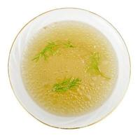 Plate with rich meat transparent broth with dill photo