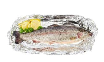 Fresh rainbow trout for baking isolated on white photo