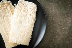 fresh enoki mushroom or golden needle mushrooms photo