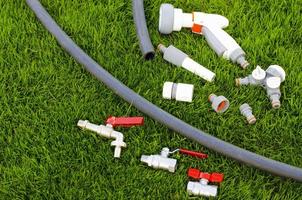 Plastic, watering can, hose for watering the garden, lawn.