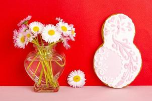 Figure eight homemade cakes and flowers on bright background. photo