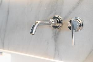 close-up tap in luxury bath room photo