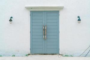 grey door with white wall photo