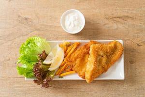 fish and chips - fried fish fillet with potatoes chips photo