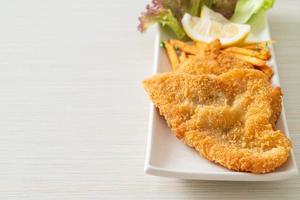 fish and chips - fried fish fillet with potatoes chips photo