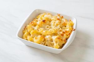 American mac and cheese, macaroni pasta in cheesy sauce photo