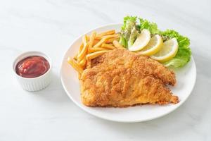 Homemade Breaded Weiner Schnitzel with Potato Chips photo