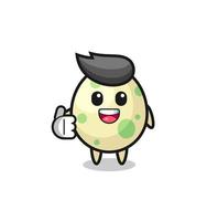 spotted egg mascot doing thumbs up gesture vector
