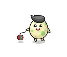 cartoon of cute spotted egg playing a yoyo vector