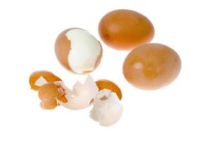 Boiled chicken eggs with colored shells on white background. photo