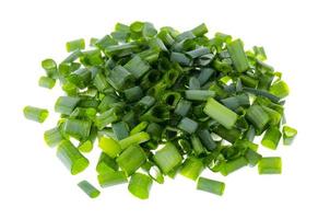 Pile of slices of fresh chives isolated on white background photo