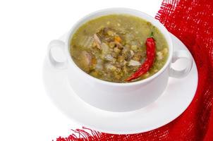 Spicy green lentil chili soup on white plate. photo