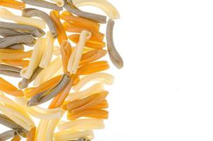 Pile of multi-colored pasta isolated on white background. photo