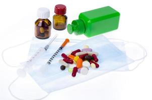 Medical masks, pills and capsules for recovery and disease prevention. photo