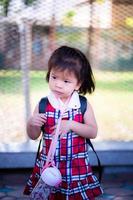 Portrait Asian baby girl. Upset face  child. Vertical image. photo