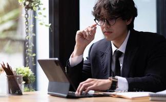 Online video conference and Digital meeting. Businessman discussing business with team by video conference in home office. photo