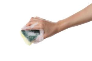 Hand holding cleaning sponge on white background photo