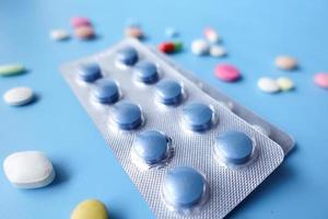 Close up of pills of blister pack on table photo