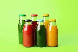 Different healthy juice on color background photo