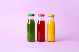 Different healthy juice on color background photo