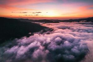 Flying above the clouds sunrise and fog photo