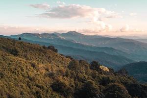 Scenic View Of Mountains Against Sky During Sunset photo