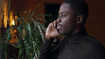 Man calling with smartphone whilst walking and sipping drink video