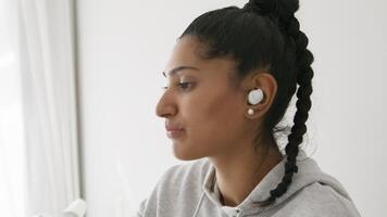 Woman having video call on smartphone