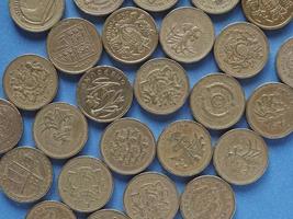 Pound coins, United Kingdom over blue photo