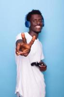 African american man showing peace sign at camera photo