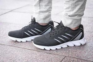 Stylish man in black casual shoes outdoors photo